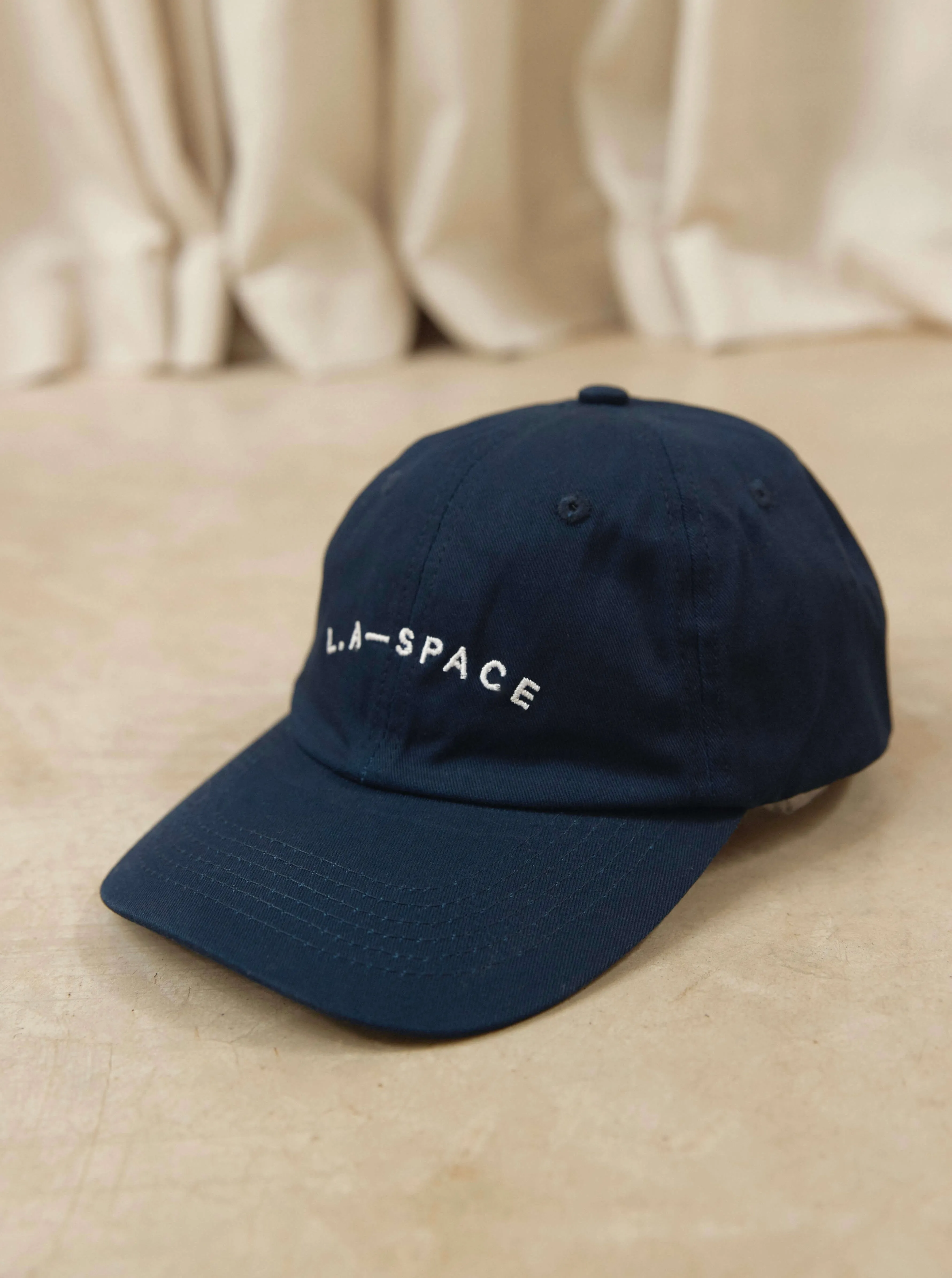 ‘L.A-SPACE’ EMBROIDERED CAP IN NAVY